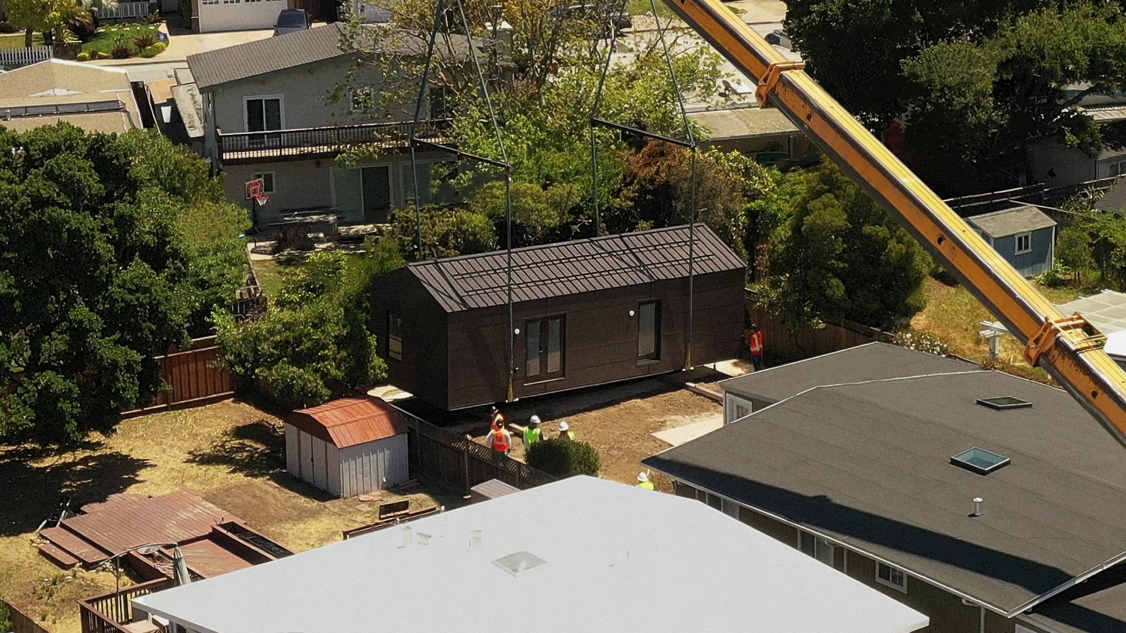 Samara's Backyard ADU being craned onto its foundation.